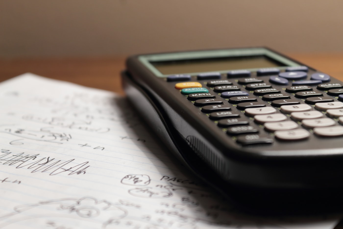 Architectural blueprints and a calculator on a desk